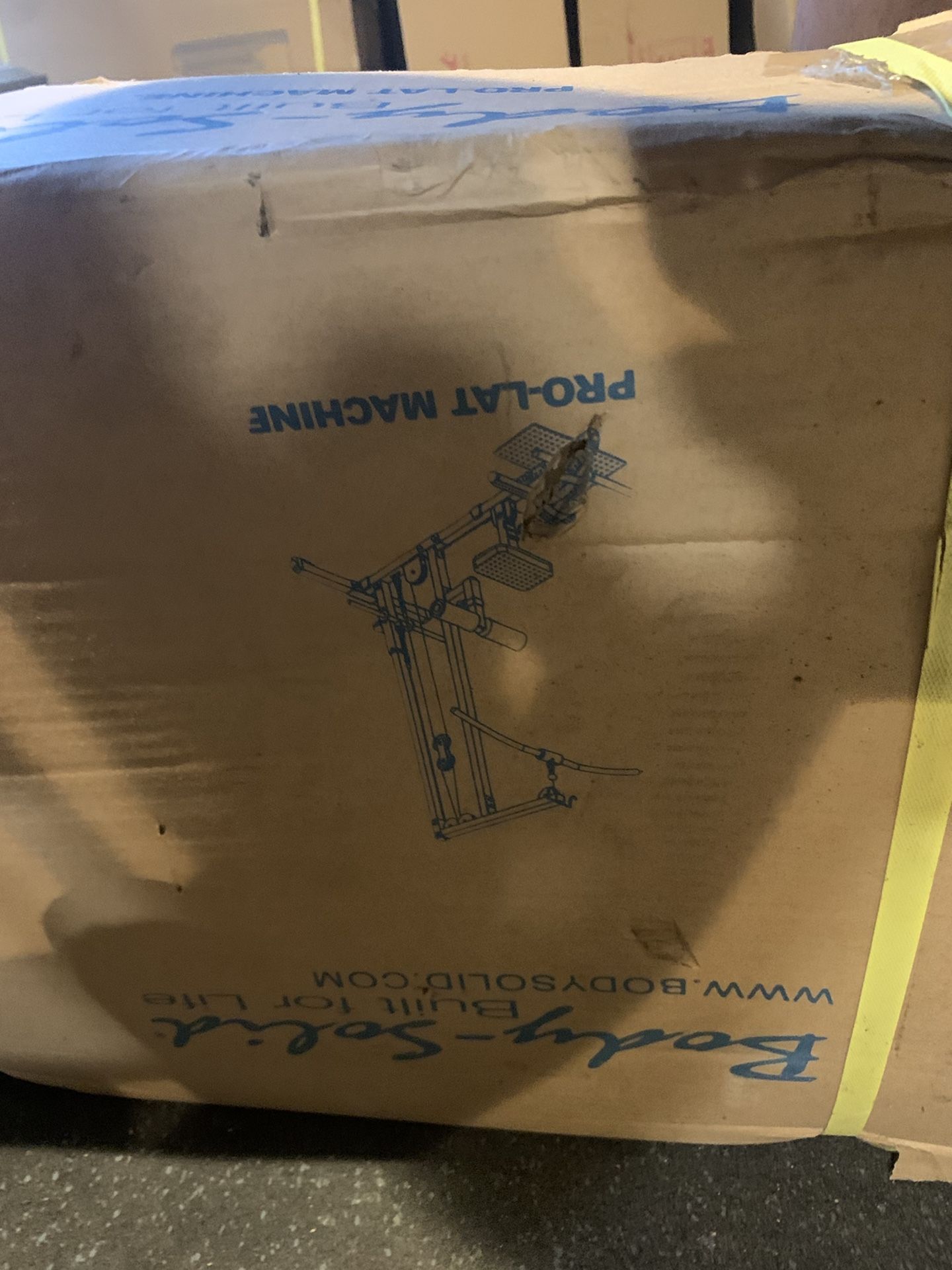 Unopened Pro-Lat Machine Body Solid GLM83