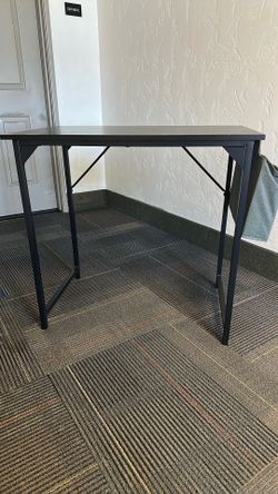 Black desk with pocke