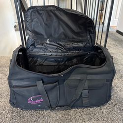 Huge suitcase – has wheels and metal handle