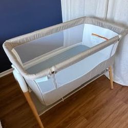 Delta Children Bondi Adjustable Height Bedside Beechwood Bassinet