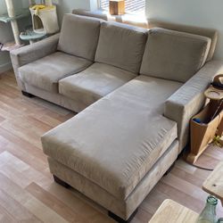 Beige couch with reversible chaise