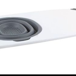 with collapsible colander over the sink cutting board