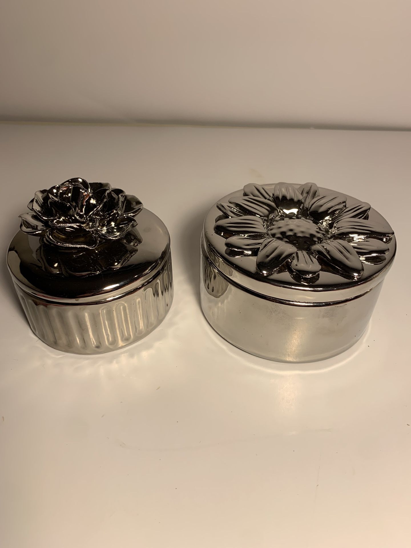 Two Silver Pewter Glazed Ceramic Pots With Flower Lids