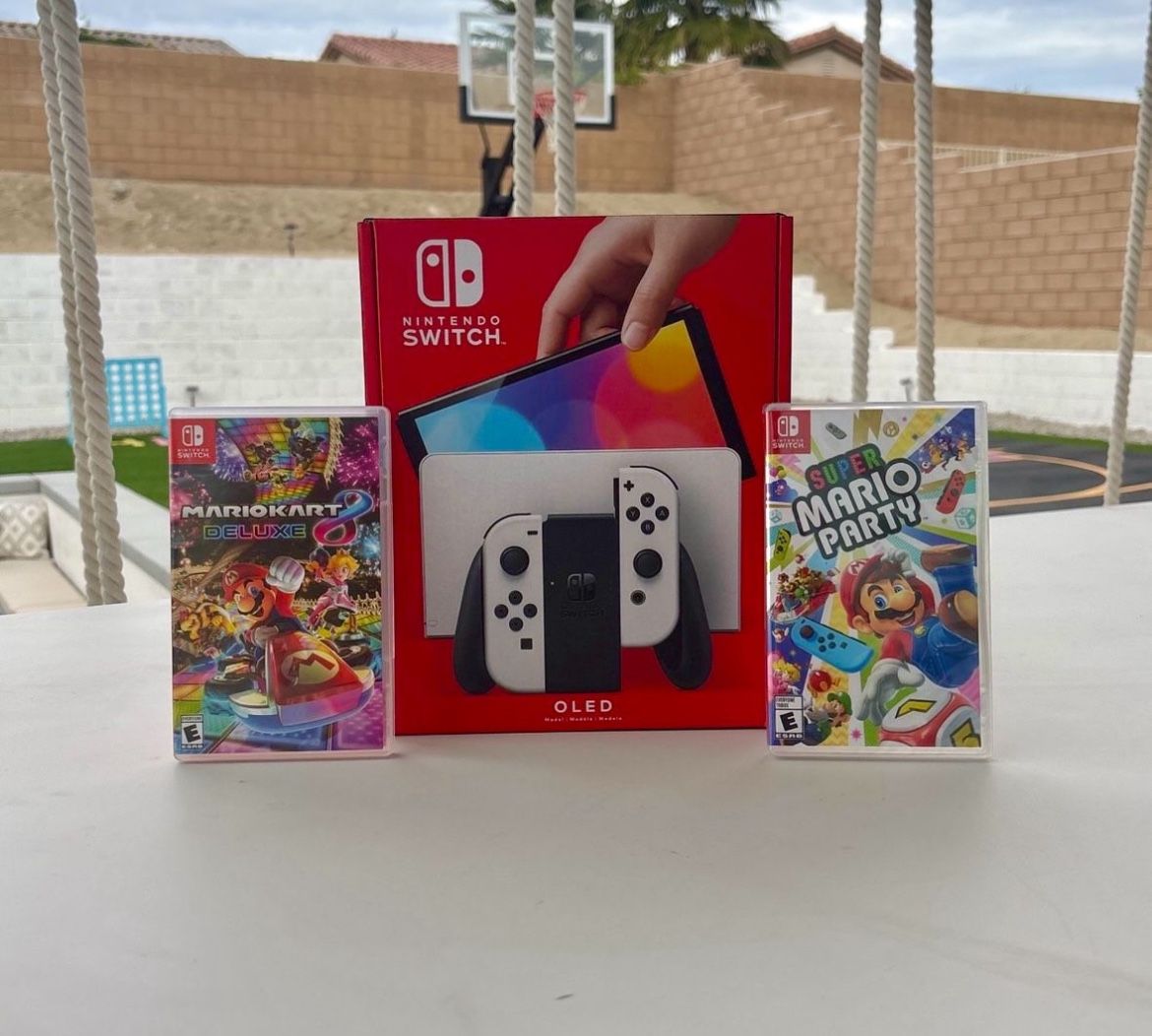 Nintendo Switch Oled with super Mario party and Mario kart deluxe 8 floor model 
