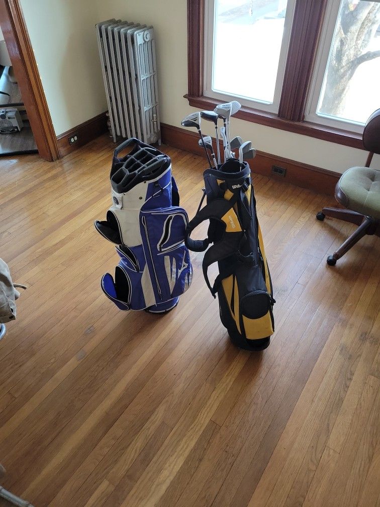 Two Golf Bags And Clubs!