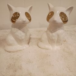A Set Of Ceramic  Figurine Racoons 