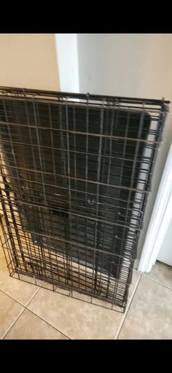 FREE large dog crate and a wet mop. Must take both