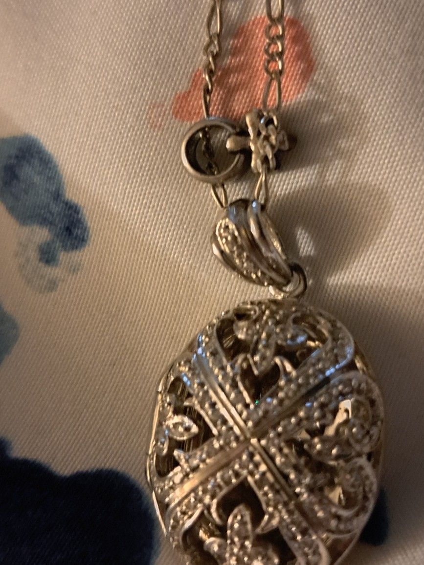 Silver Pendant Encrusted In Stones