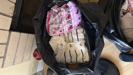 Bags of clothes for girls and some guy clothes