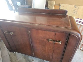 1930s–1940s Art Deco “waterfall” 1930s–1940s Art Deco “waterfall” style dry bar/buffet cabinet,