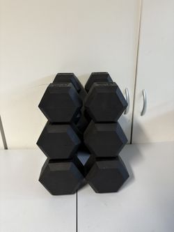 Brand new Pairs of 20 25 and 30 lbs dumbbells
