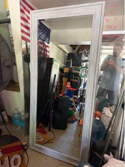 Sturdy floor-length mirror with a white-washed wood-textured frame