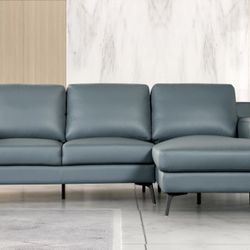 Blue Faux Leather Sectional. Have left or right chaise 