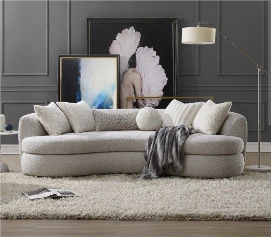 Brand New Gorgeous Curved Sofa upholstered in ivory performance fabric with accent pillows included