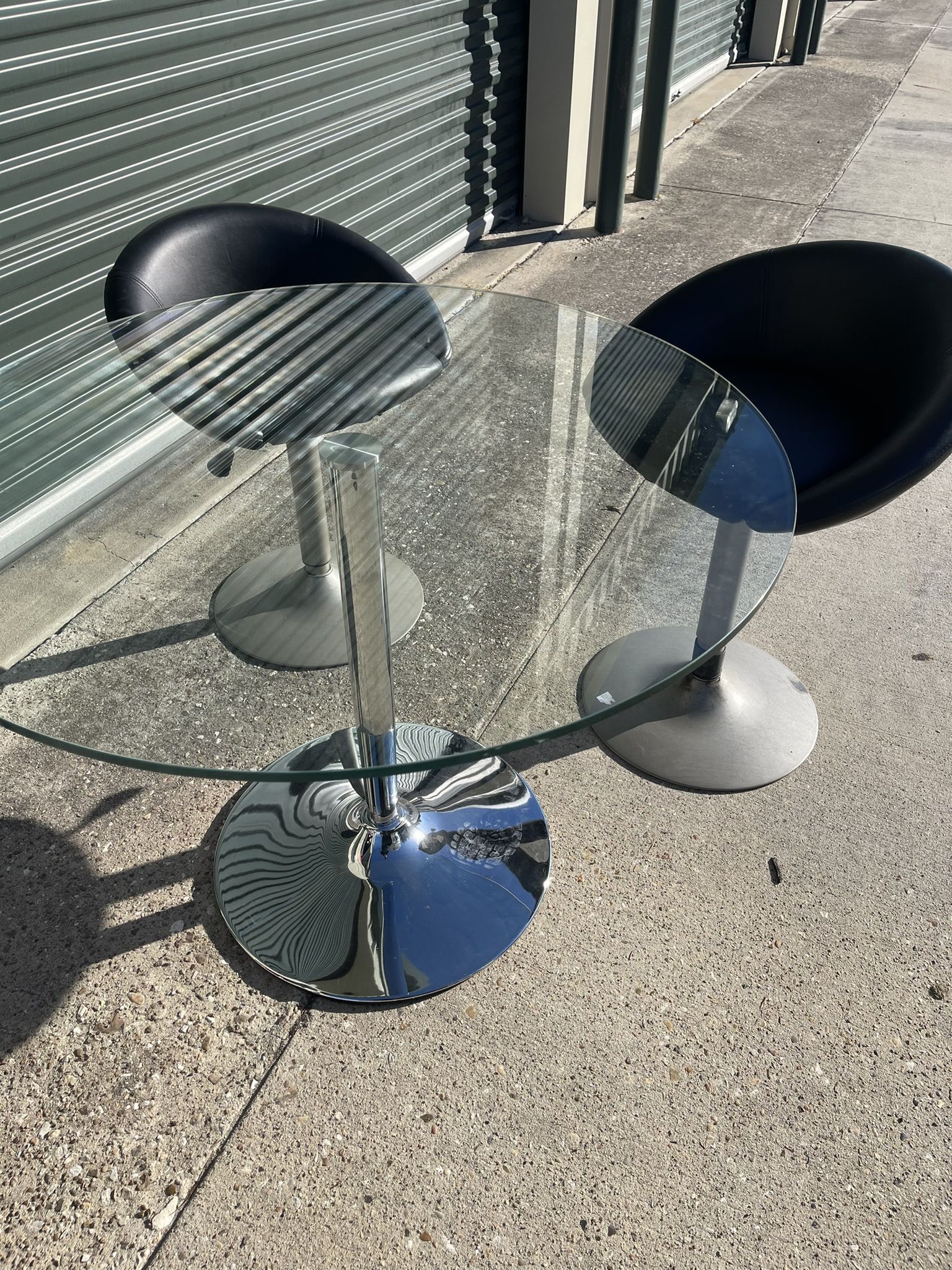 mid-century modern glass and chrome pedestal table
