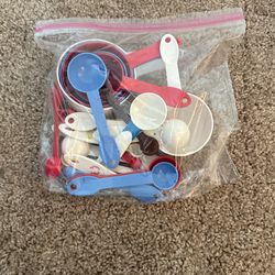 Assorted Plastic Measuring Cups, Tablespoons And Teaspoons