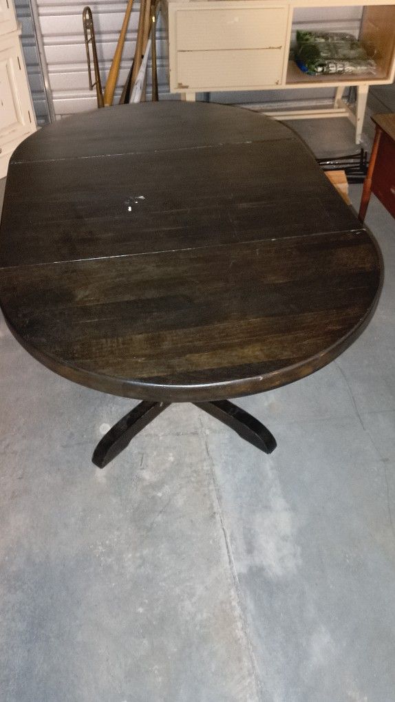 Solid Wood Table With Fold Down Leaves.