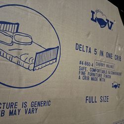 Delta 5-in-One Full-Size Wooden Crib in its original  box. 