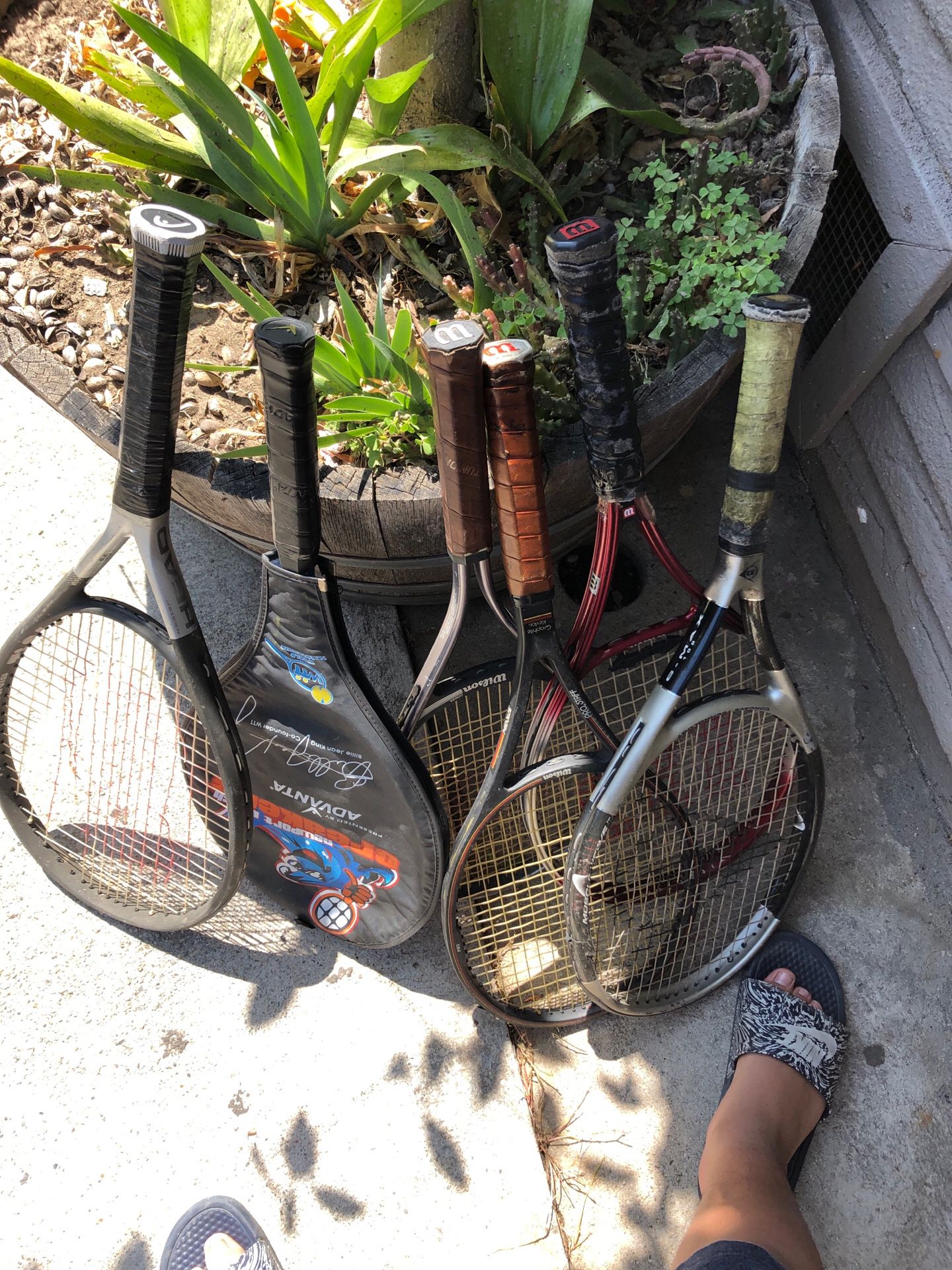 6 tennis rackets for $20 only the middle one is in its case