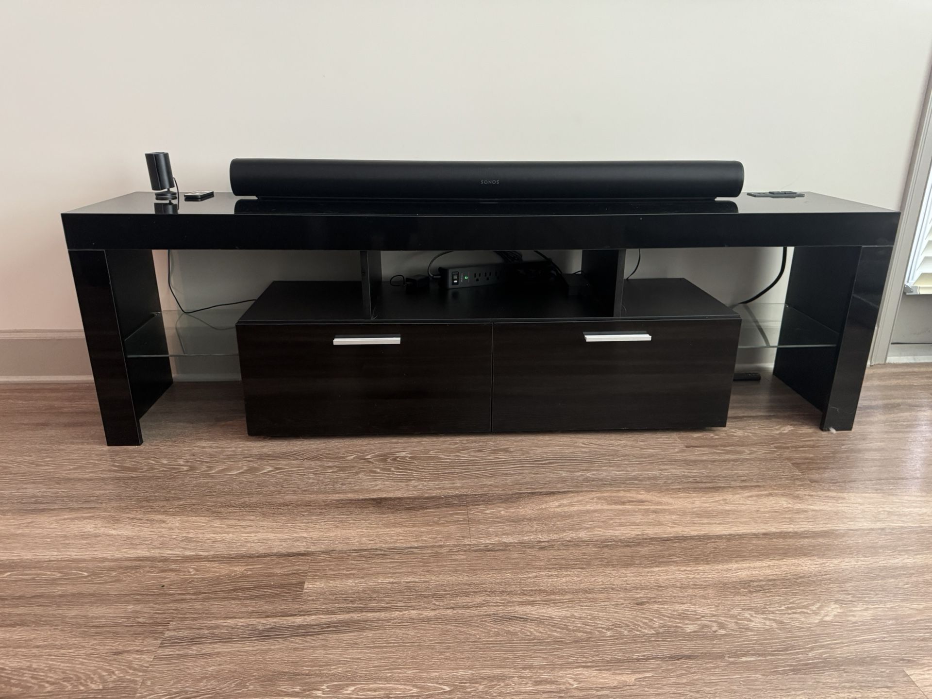 Black glossy entertainment center with storage