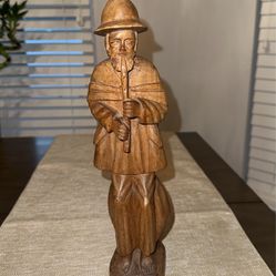 Vintage Wood Carving Of a Man Playing A Flute 
