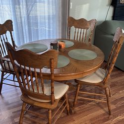 Round solid wood dining table with 4 chairs