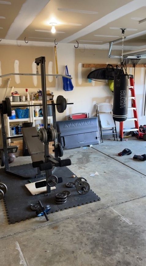 Weights, Older Bench with mats, Punching Bag Included w/ Gloves 