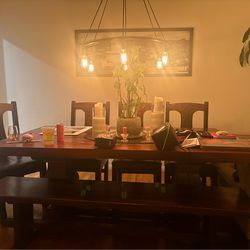 Gorgeous  sturdy dining table and chairs! Beautifully custom made. Lived in feel but a gorgeous table  to sit the family around! It has been deeply lo
