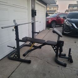 Gold's Gym XRS 20.  Adjustable Olympic Workout Bench With Squad Rack, Adjustable Safety Spotters And Weight Storage. Leg Extension, Preacher Curl.