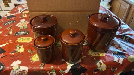 Four piece brown glass canister set