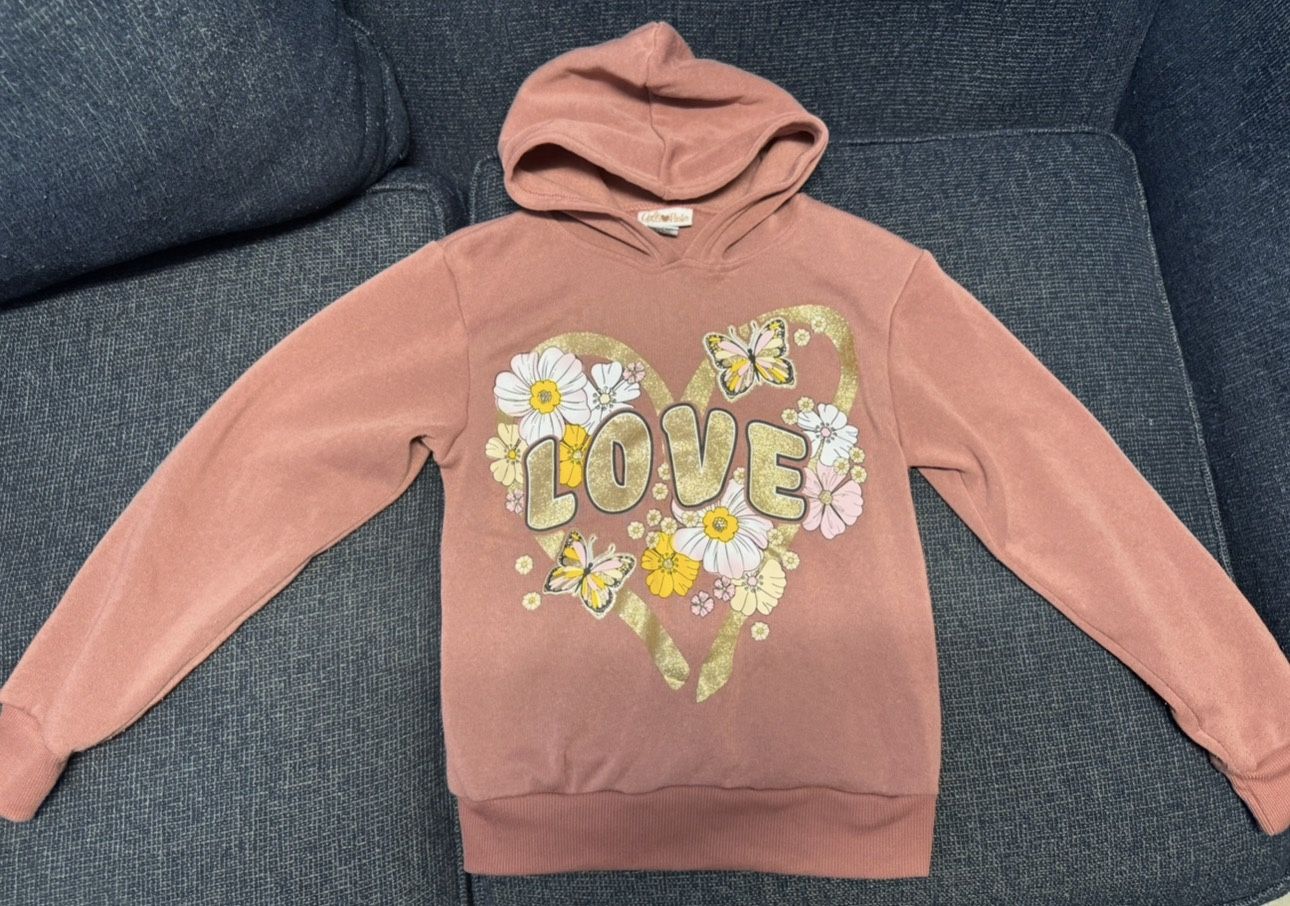 Girl’s pink hooded sweatshirt with a floral "LOVE" graphic