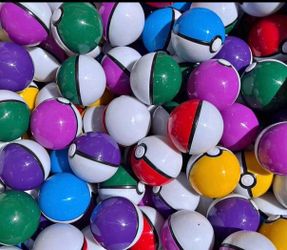 Multi color pokeball 5cm with pokemon figurine inside.