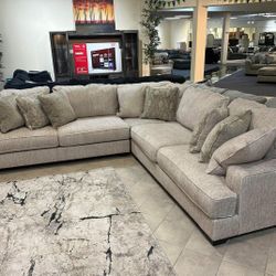 Rawcliffe Parchment 3-Piece Sectional Couch. 
