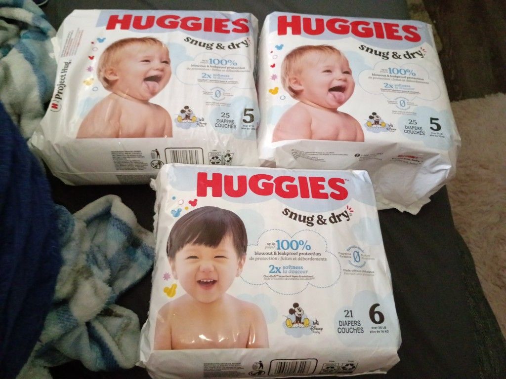 3 packs of Huggies snug and dry,unopened.1 pk size 6,2 pks size 5