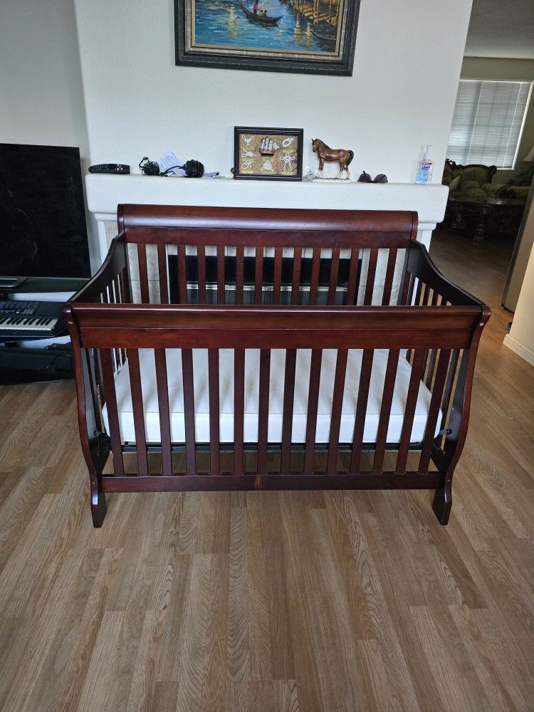 Delta Children's 4-in-1 Convertible Crib + Mattress