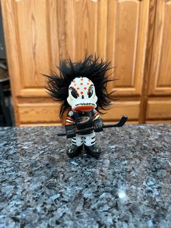 Anaheim Ducks NHL Wild Wing Troll figure. Size approximately 4 inches tall. Has been on display in a cabinet with an Anaheim Ducks collection.
