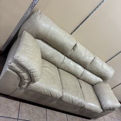 * Like New * Ashley furniture 1pc tan leather couch ( Free Delivery )