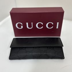 Black Gucci wallet in original box. 