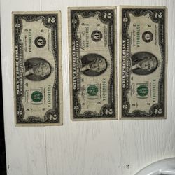 three two-dollar bills