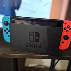 Nintendo Switch with Neon Blue and Neon Red Joy Con Bundle