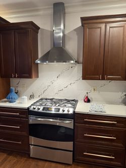 GE Profile Gas Range With Stainless Wall Mount Range Hood