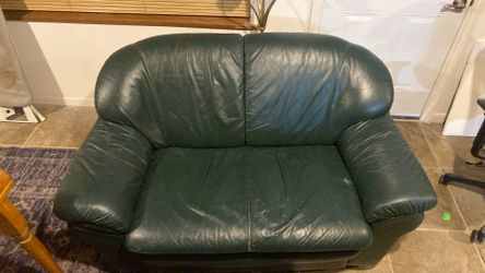 Dark green love seat