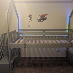 Loft bed frame with slide