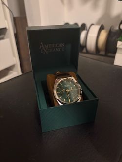 Geoffrey Beene Men’s Green Dial Gold Tone Watch