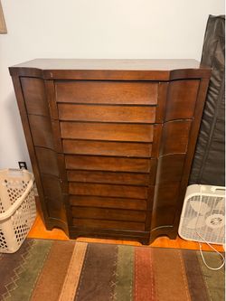 Curved front wooden tallboy dresser