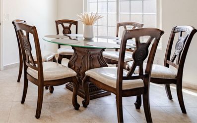 Round Glass Top Dining Table + 6 Chairs – Carved Wood Pedestal