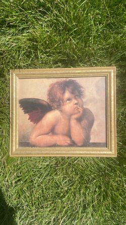 framed art print of the iconic cherub from Raphael's famous Renaissance masterpiece, the Sistine Madonna