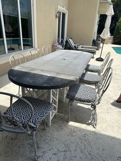 Large long tables with chairs and cushions