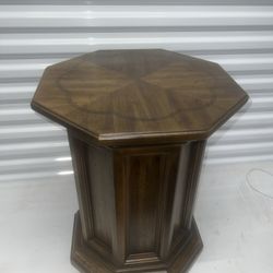 Vintage Octagonal Pedestal End Table Lamp Table Sold Wood. Used in good condition with some minor cosmetic blemishes. There are a few light scratches 