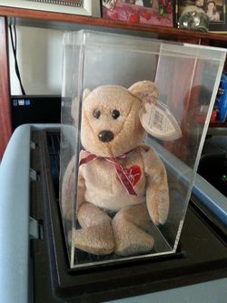Tan colored beanie baby bear